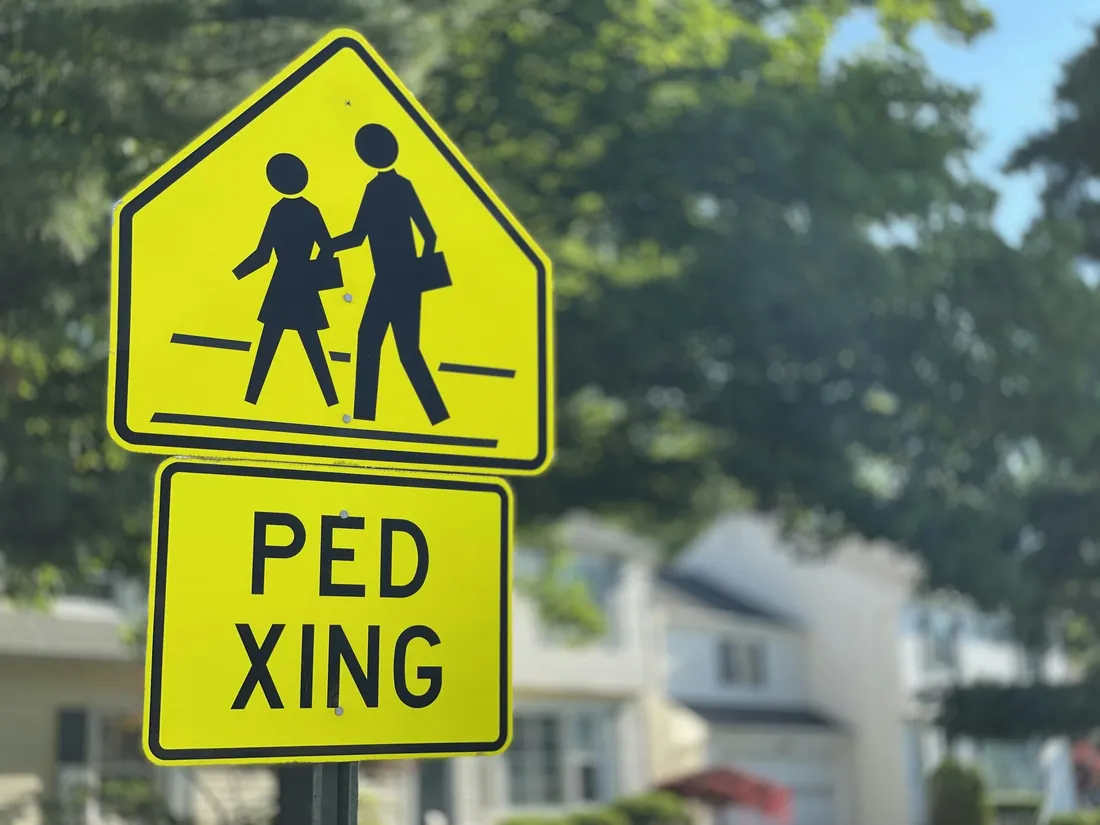 Pedestrian crossing sign on a residential street